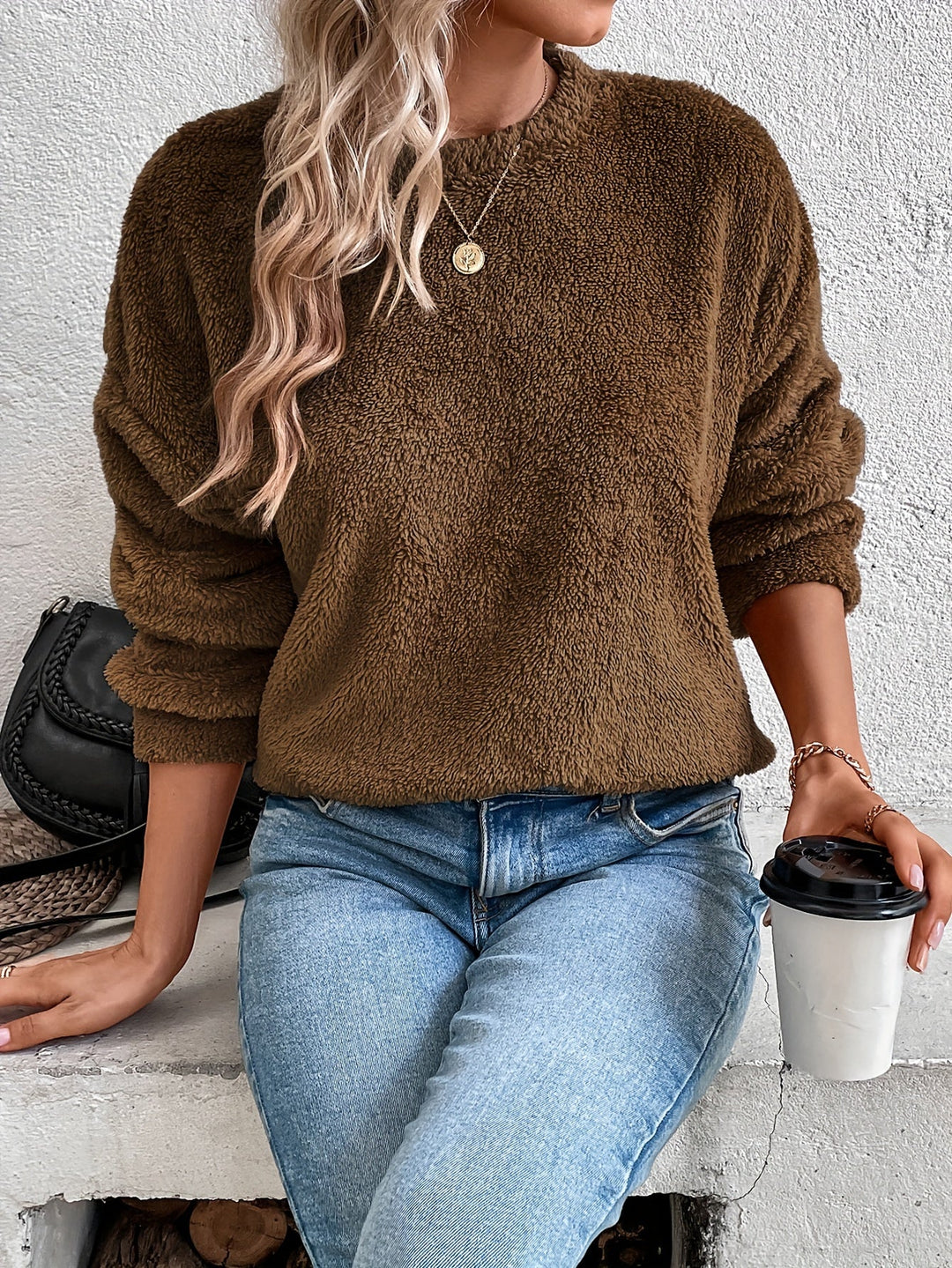 Plush & fuzzy women's pullover sweatshirt. Ultra-soft teddy fabric, long-sleeve, ideal for cozy fall and winter wear.