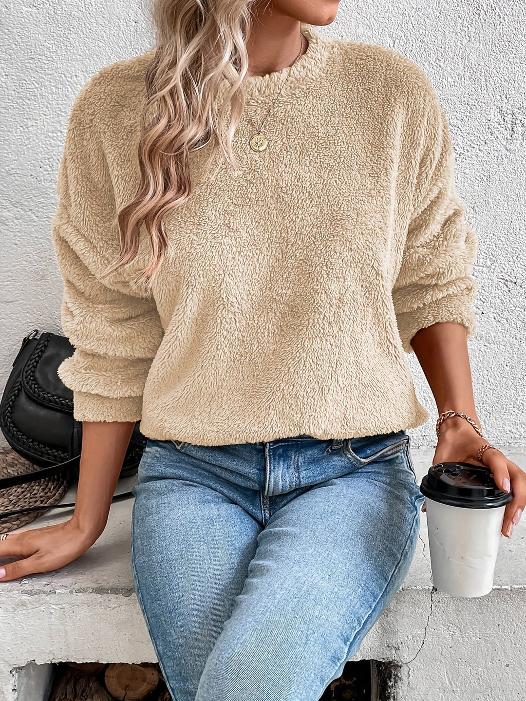 Warm women's fuzzy pullover sweatshirt, made from ultra-soft teddy fabric. Perfect long-sleeve cozy top for winter.