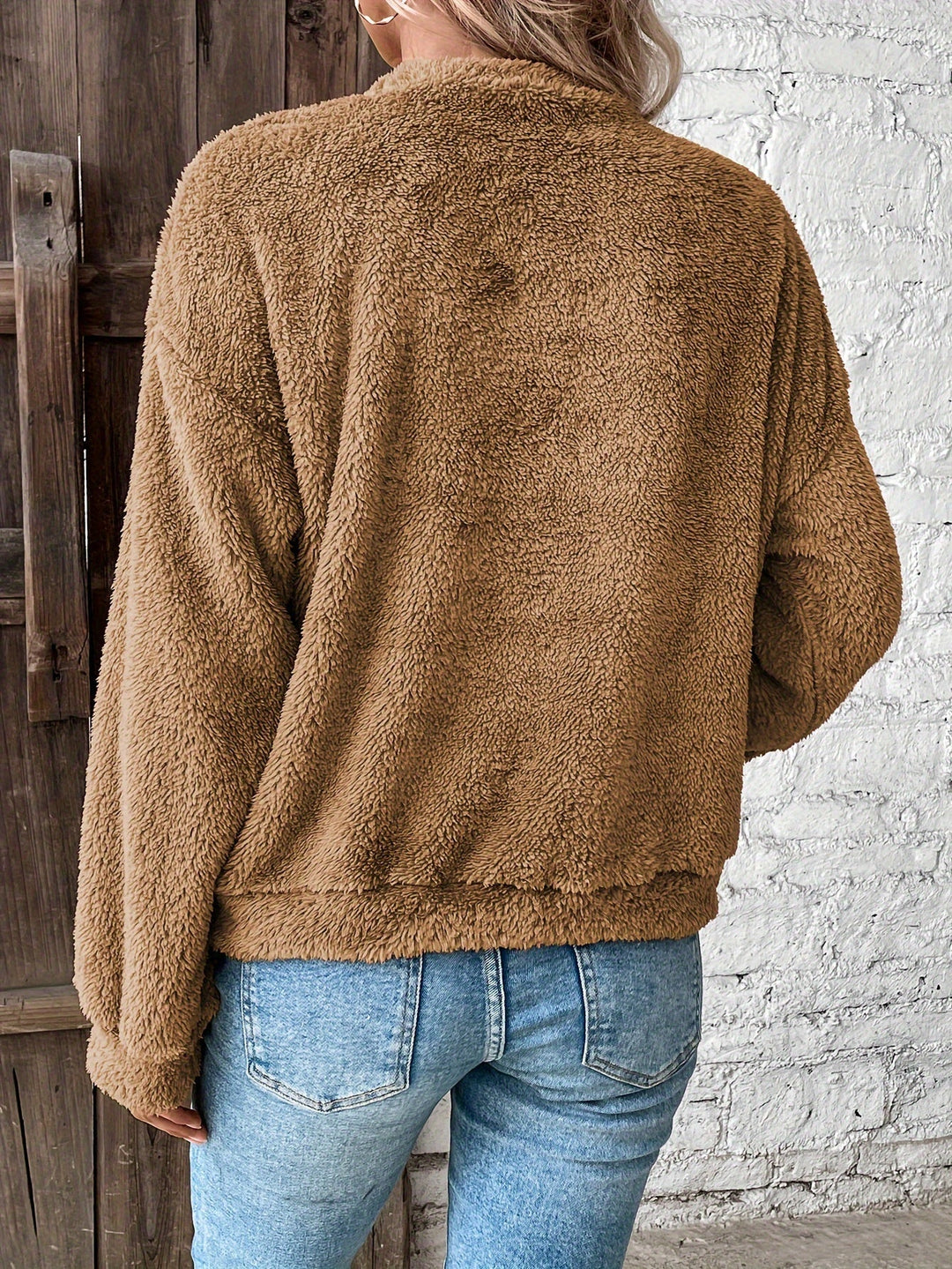 Ultra-soft fuzzy women's long-sleeve pullover sweatshirt. Cozy round-neck teddy top, great for relaxed fall & winter casual wear.