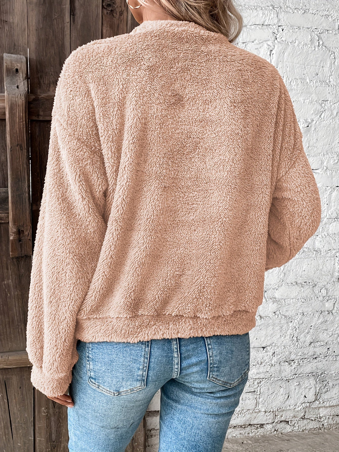 Cozy & soft women's fuzzy teddy pullover sweatshirt. Warm long-sleeve top, essential for fall and winter fashion comfort.