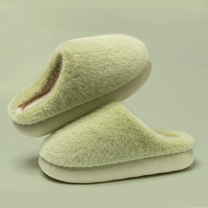 Cozy women's house slippers, ultra-soft plush for warm, cushioned indoor comfort.