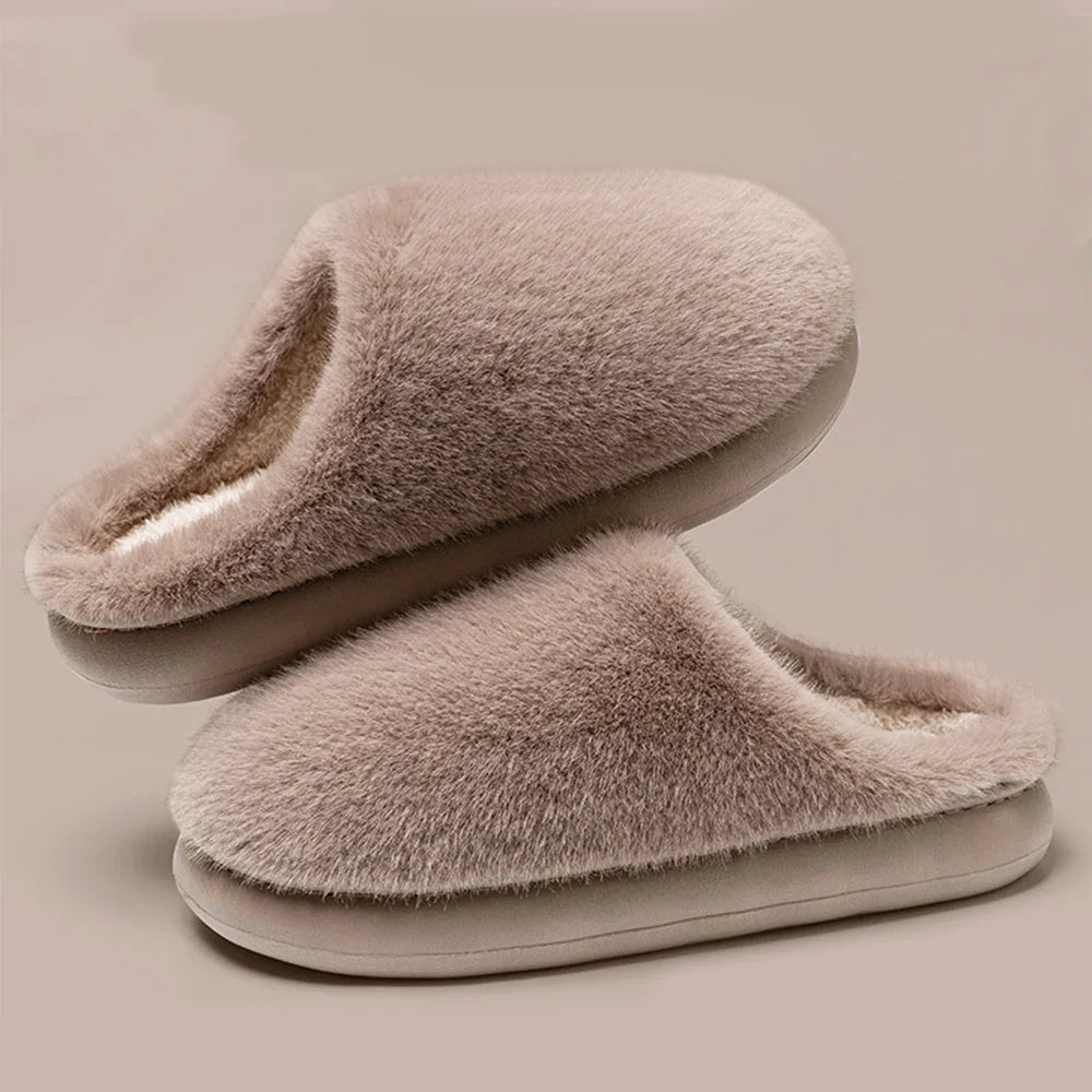 Relax in ultra-soft women's plush house slippers, offering cozy warmth & cushioned support for your feet.