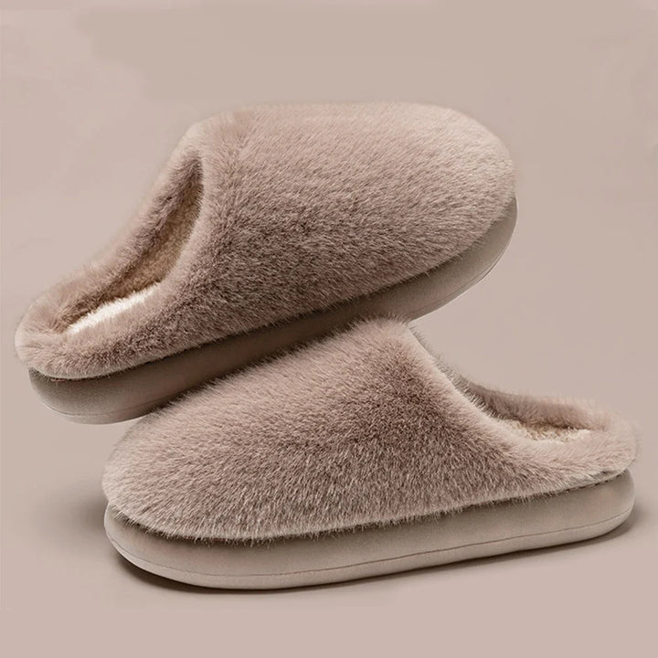 Relax in ultra-soft women's plush house slippers, offering cozy warmth & cushioned support for your feet.