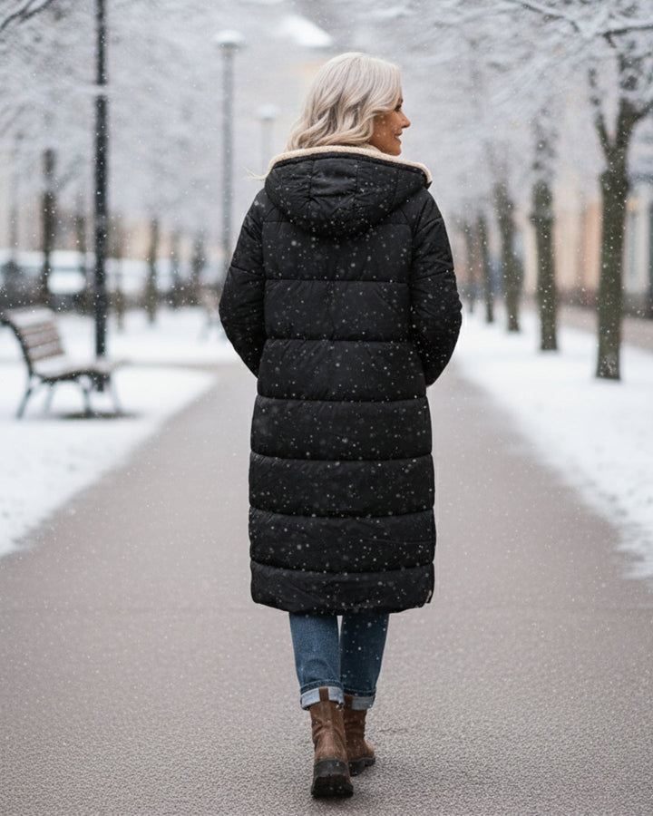 Elegant women's ultra-warm quilted winter coat. Stylish long outerwear for cold weather protection.