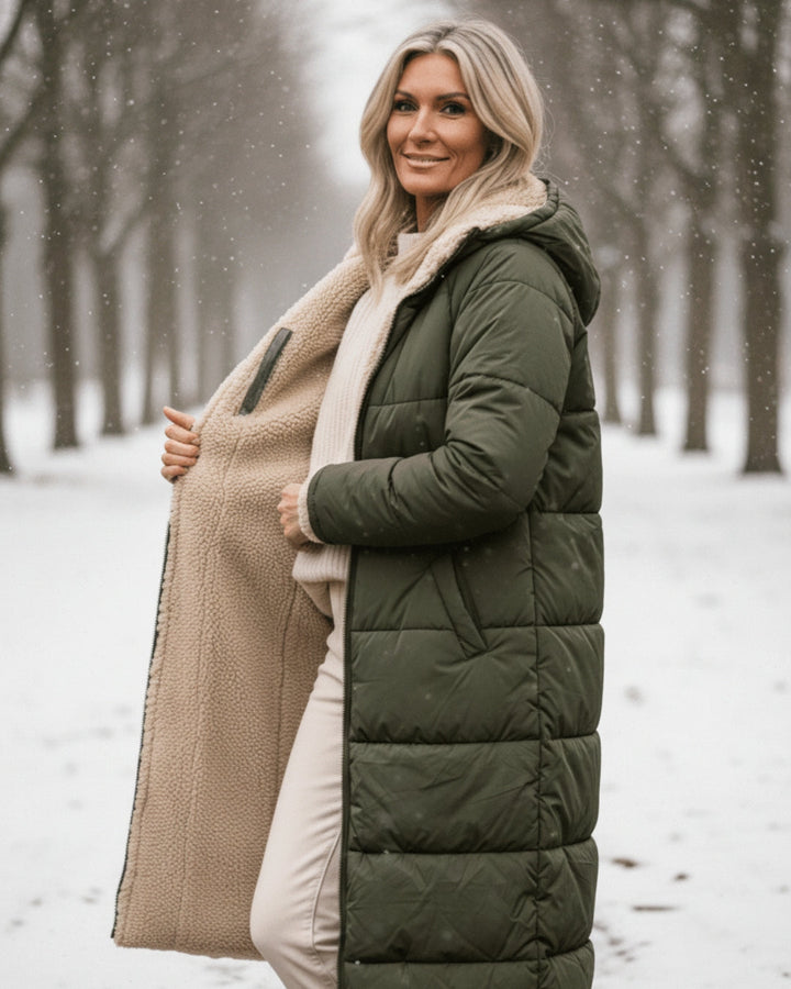 Fashionable women's long quilted winter coat. Ultra-warm seasonal wear for cold weather.
