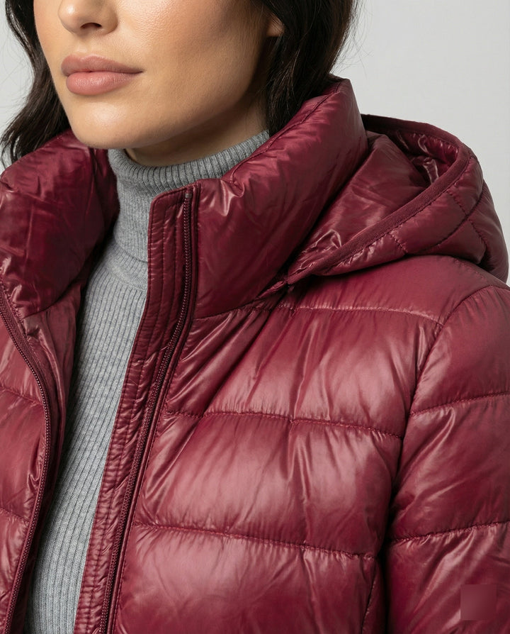 Lightweight, insulated women's hooded jacket for transitional and all-season wear.
