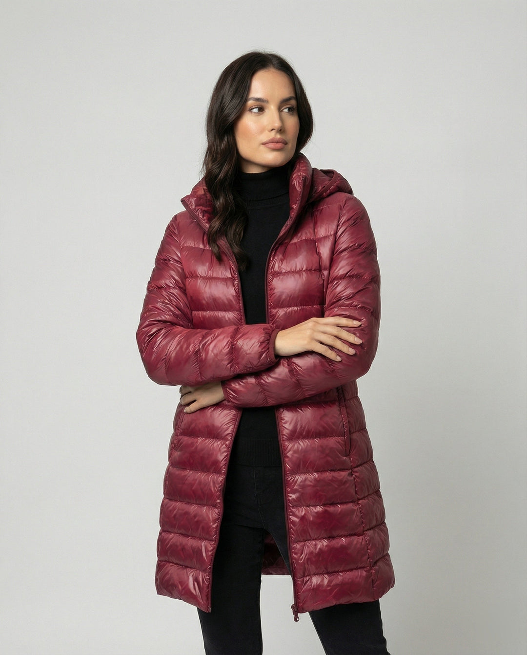 Wind-resistant, ultralight insulated hooded jacket for women's all-season comfort.