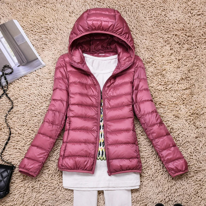 Women's travel-friendly insulated hooded jacket, ultralight & compact.