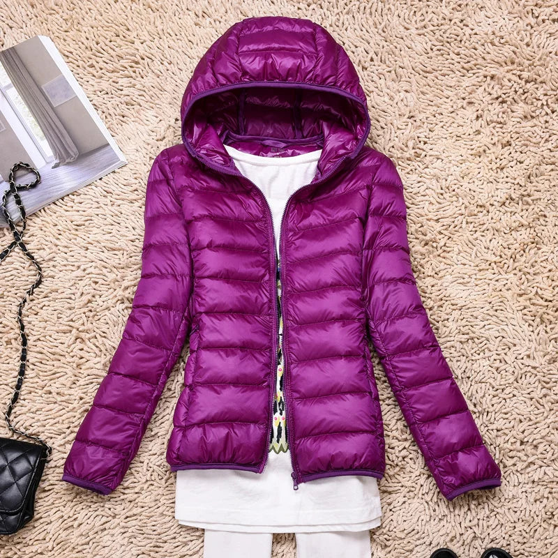 Durable women's winter outerwear, insulated, hooded, packable, & lightweight.