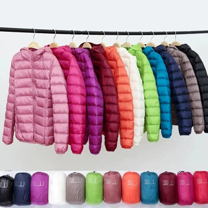 Packable women's winter outerwear, ultralight design with insulated hood & zipper.