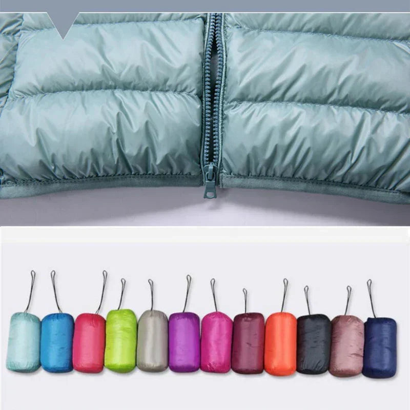 Warm women's travel jacket, ultralight, insulated, hooded, and easily packable.