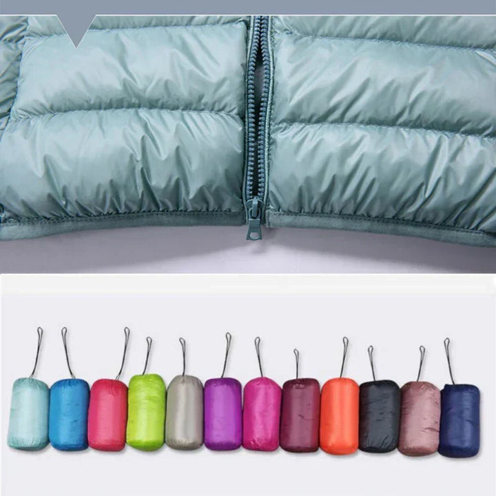 Warm women's travel jacket, ultralight, insulated, hooded, and easily packable.