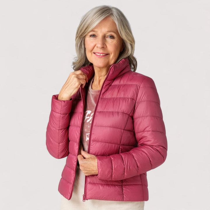 Modern women's ultralight puffer jacket, warm, weather-resistant, and fashionable.