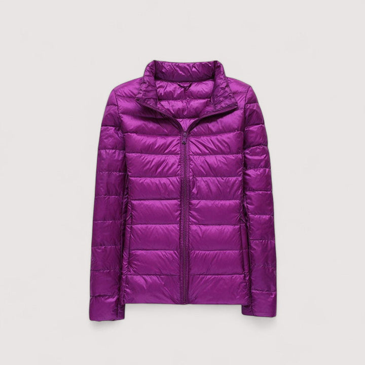 Travel-friendly women's ultralight jacket, a warm & cozy winter essential.