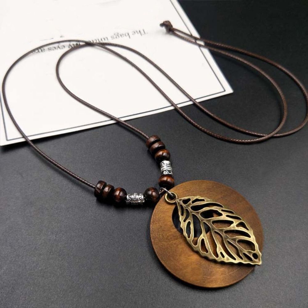 Natural wooden boho necklace for women, a unique retro round pendant jewelry piece.