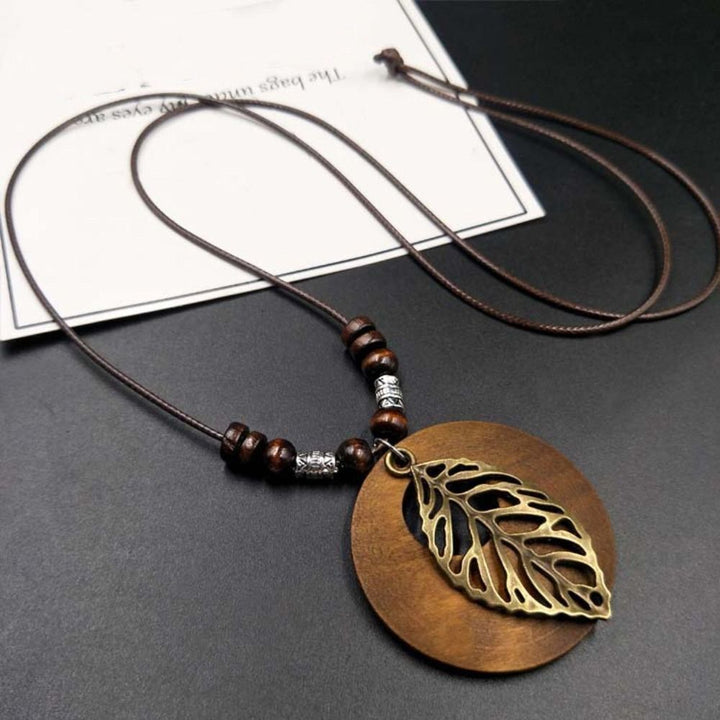 Natural wooden boho necklace for women, a unique retro round pendant jewelry piece.