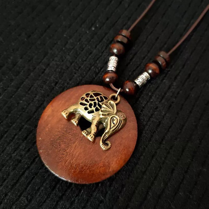 Women's unique boho wooden pendant necklace, featuring a distinct retro round style.