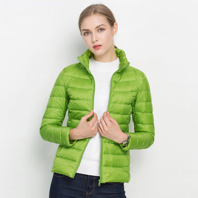 Woman in a chic lightweight puffer jacket enjoying an urban walk; perfect fall fashion outerwear.