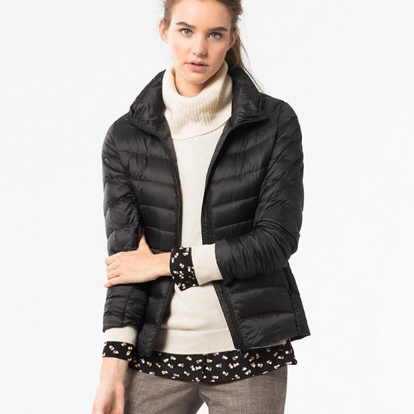 Stylish women's urban chic lightweight puffer jacket, offering both fashion & function for cooler weather.