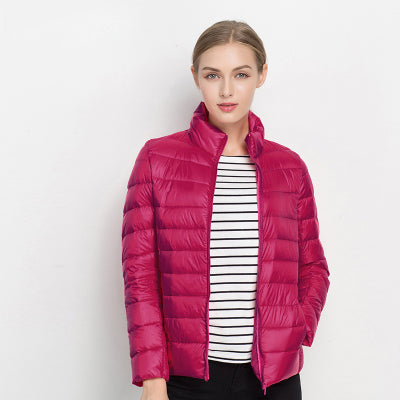 Woman showcasing a sleek urban chic lightweight puffer jacket, perfect for a modern city look.