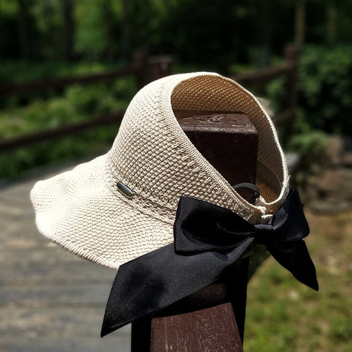 Lightweight women's straw sun hat with ponytail compatibility, ensuring UV safety & comfort