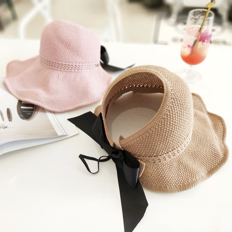 Natural straw sun hat for women with UV protection & ponytail slot, great for outdoor adventures