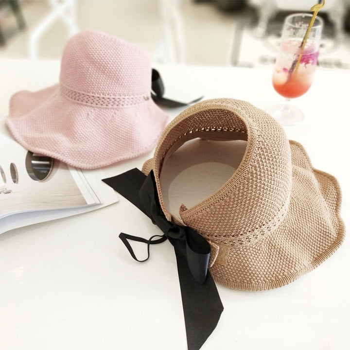 Natural straw sun hat for women with UV protection & ponytail slot, great for outdoor adventures