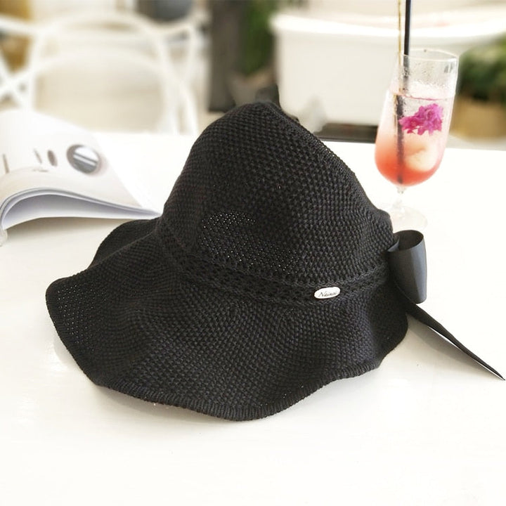 Fashionable women's beach hat, straw material with ponytail opening for sun safety & style