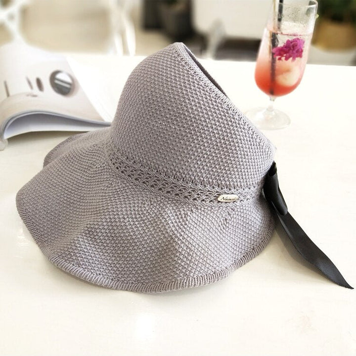 Summer accessory: women's UV protect ponytail straw sun hat, versatile for travel & beach