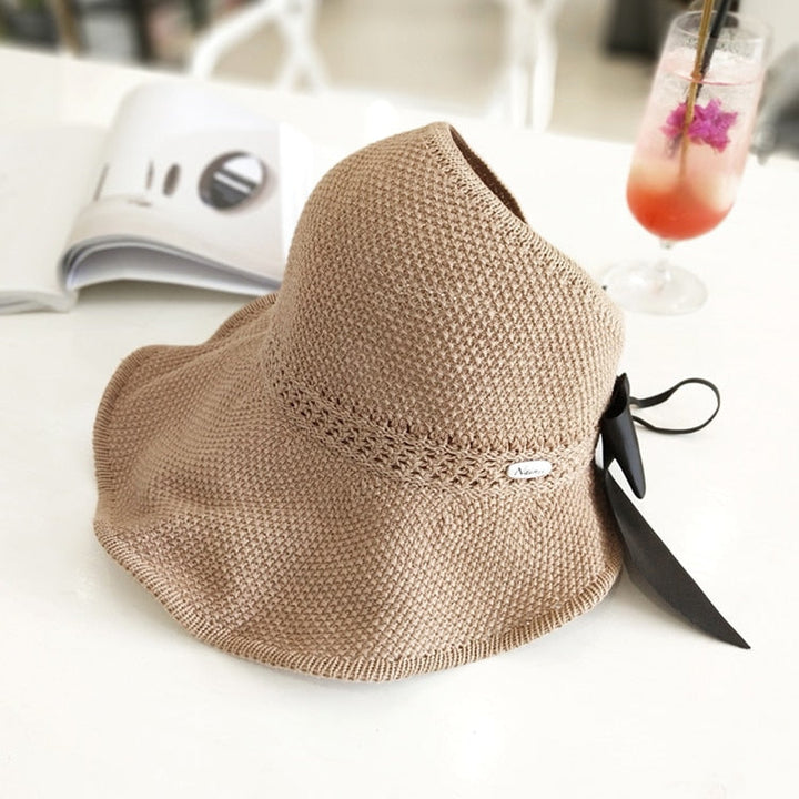 Women's straw sun hat, designed for ponytails, effective UV protection for any outdoor activity