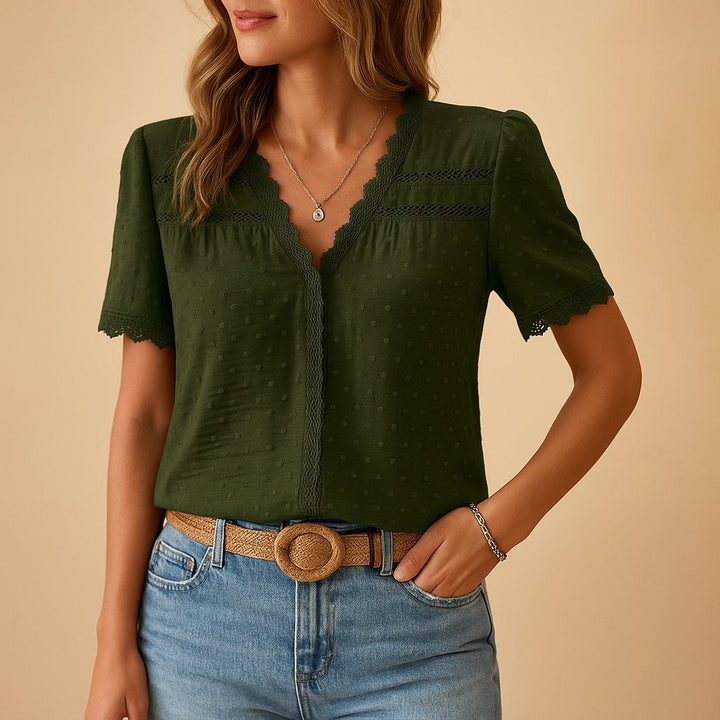 Casual women's short sleeve V-neck top, featuring feminine lace details & textured dot pattern.