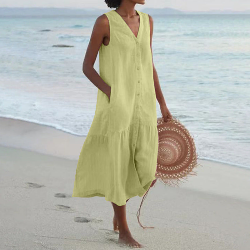 Sleeveless V-neck tiered midi dress with button accents, perfect for women's warm-weather fashion.