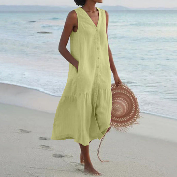 Sleeveless V-neck tiered midi dress with button accents, perfect for women's warm-weather fashion.