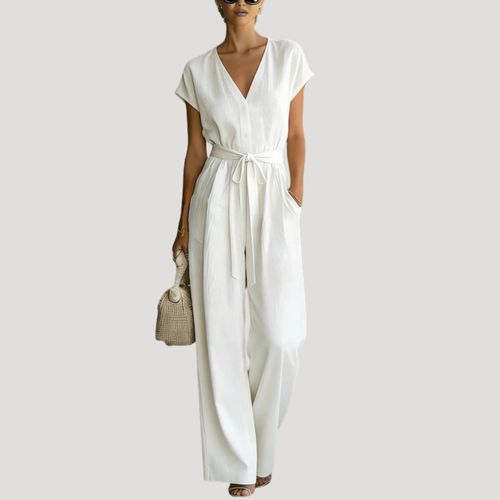 Women's V-neck cap sleeve wide leg jumpsuit with tie waist, perfect for elegant summer fashion & day to night wear.