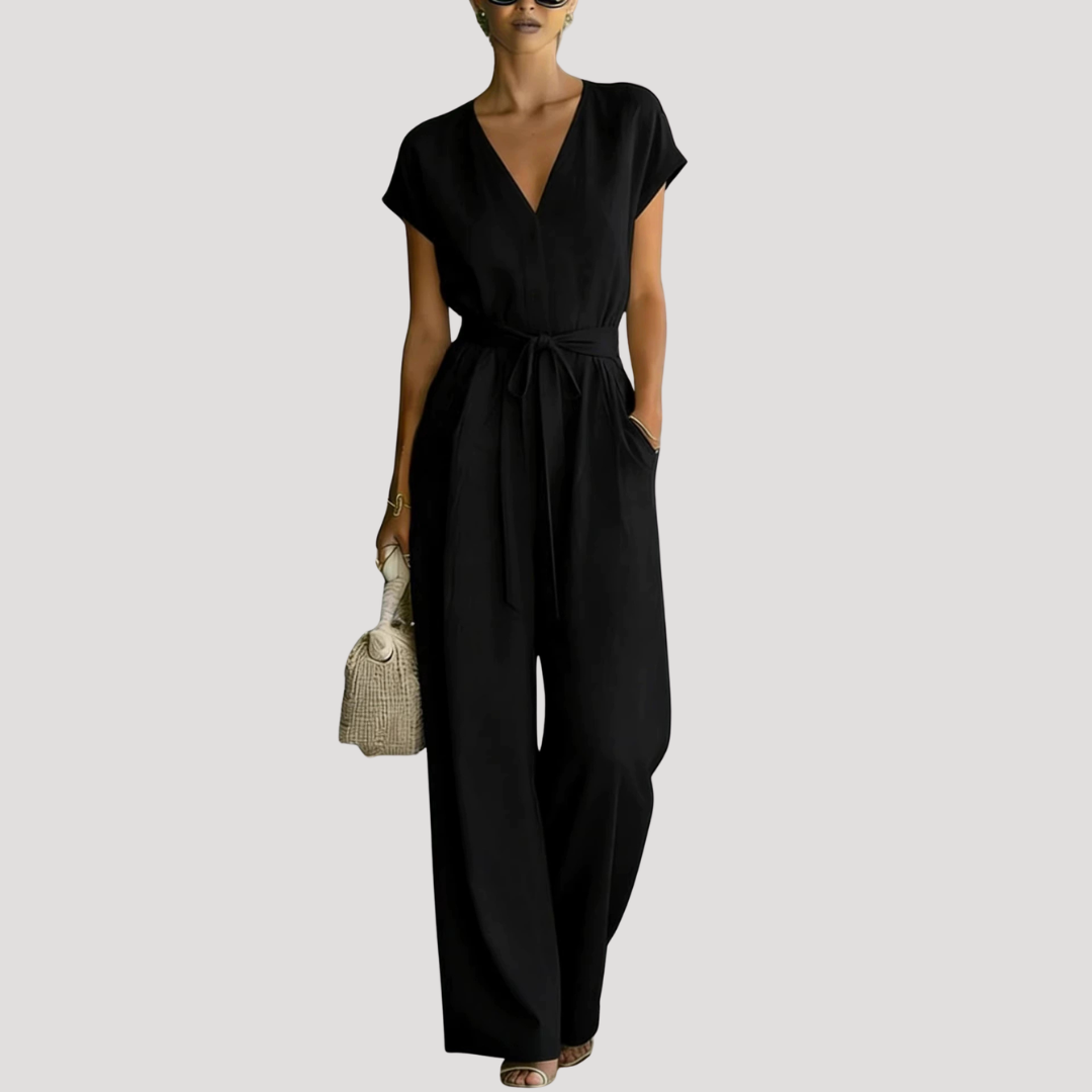 Stylish women's one-piece V-neck jumpsuit with cap sleeves, flowy wide legs & adjustable tie waist for summer.