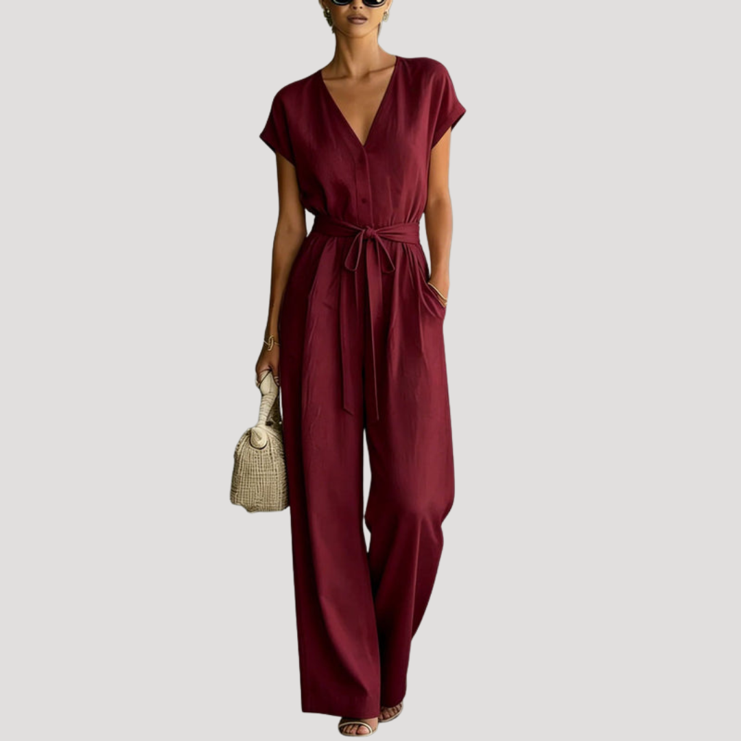 Full-length women's jumpsuit: V-neck, cap sleeves, self-tie waist & wide leg pants. Comfortable & flattering one-piece.