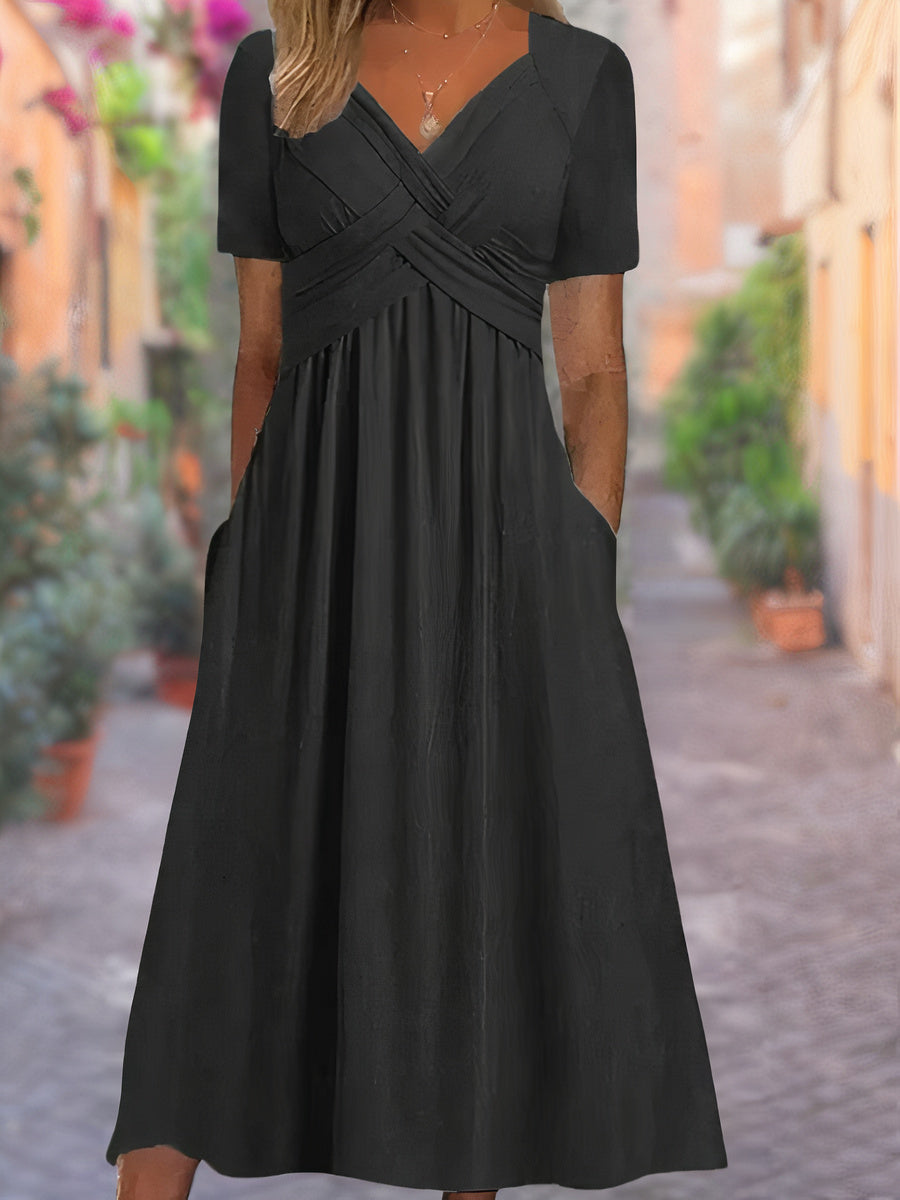 Stylish women's midi dress with striking crisscross V-neck bodice, suitable for casual or formal occasions.