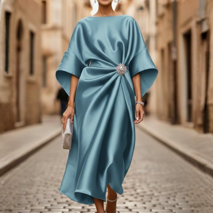 Elegant V-neck elbow sleeve midi dress for women, featuring a comfortable flared skirt. Stylish day or office wear.