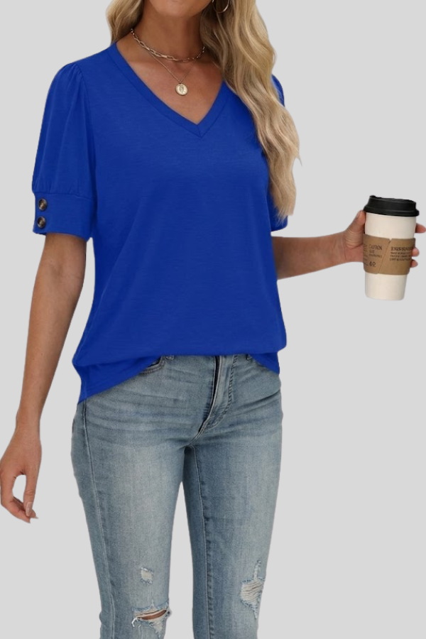 Model wearing a relaxed fit V-neck gathered sleeve top, an elegant women's blouse for summer comfort.