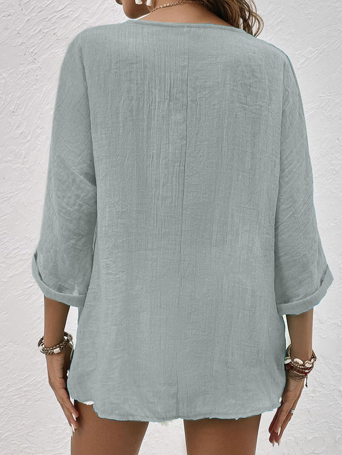 Casual women's long sleeve V-neck shirt with button-down front, relaxed fit, ideal for versatile spring styling.