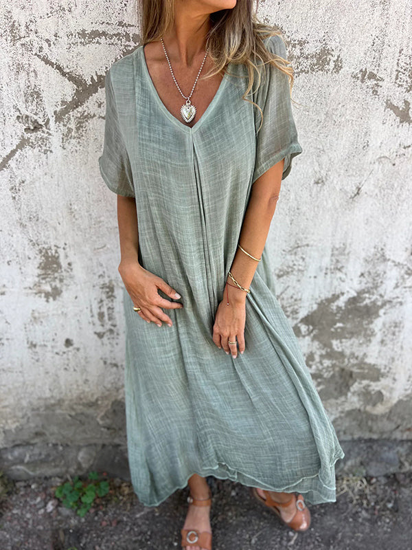 Casual V-neck midi dress, perfect women's holiday or travel wear with a loose fit.