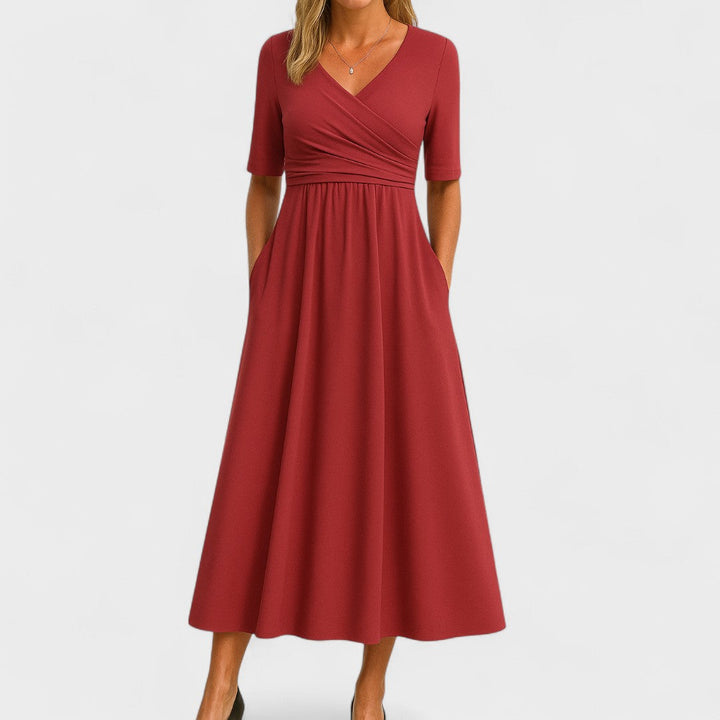 Stylish women's V-Neck Midi Dress showcasing a unique crossover waist design and practical pockets.