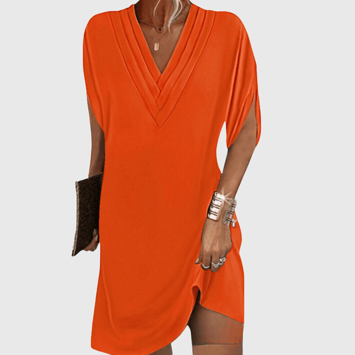 Versatile women's short sleeve V-neck mini dress in a relaxed fit, perfect for beach, vacation, or casual summer outings.