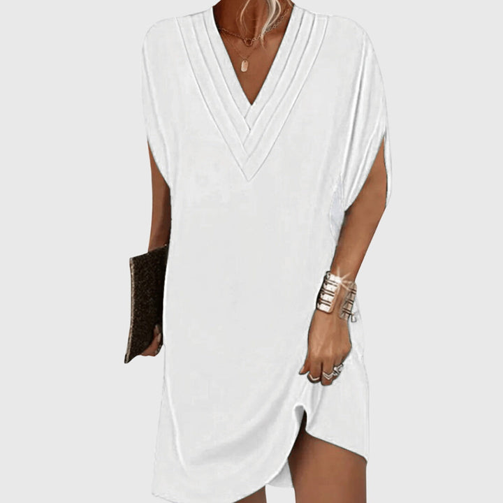 Women's V-neck mini dress with short sleeves and a relaxed, comfortable fit for effortless summer fashion.