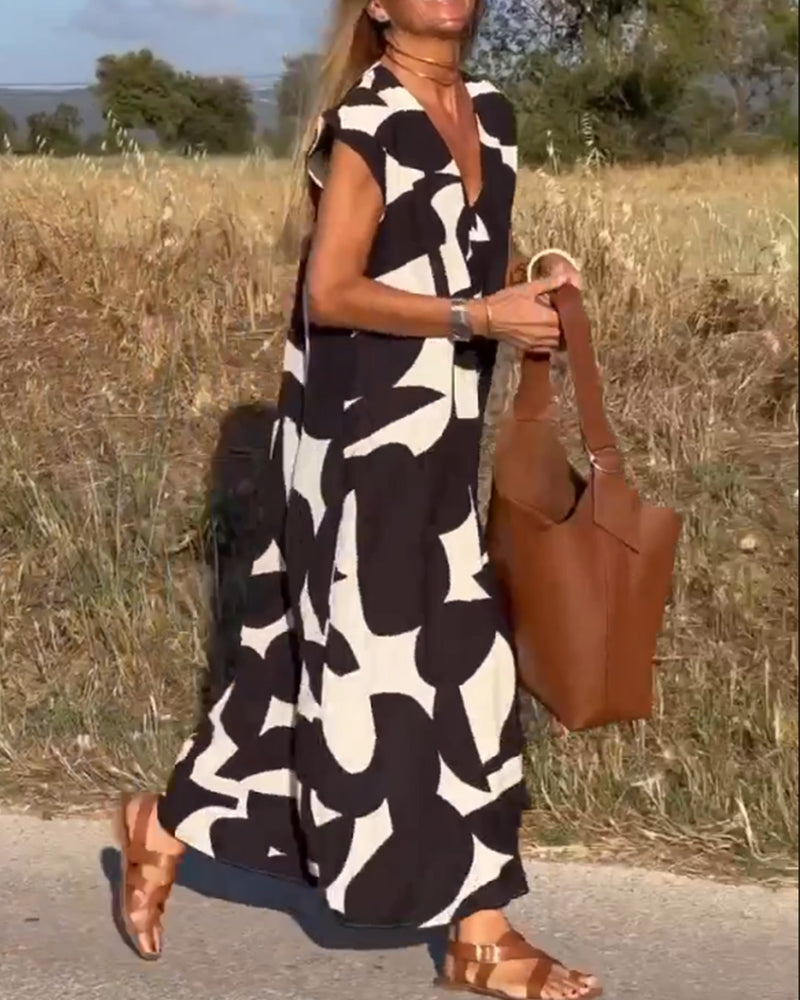 Women's short sleeve V-Neck Maxi Dress with an elegant, breezy print for effortless style.