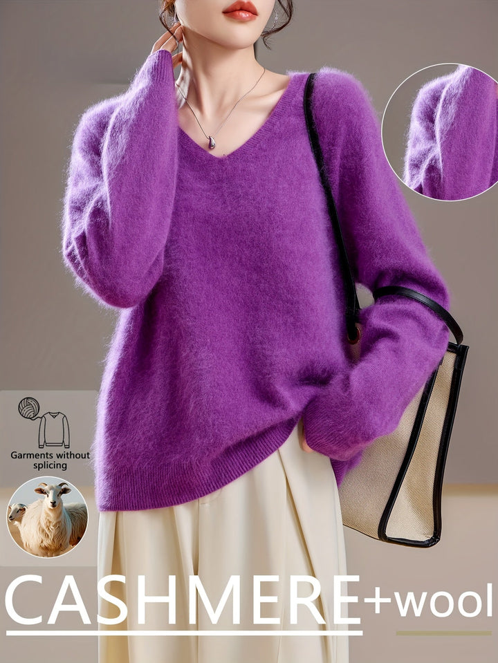 Relaxed fit women's V-neck pullover sweater, cozy & comfortable for autumn.