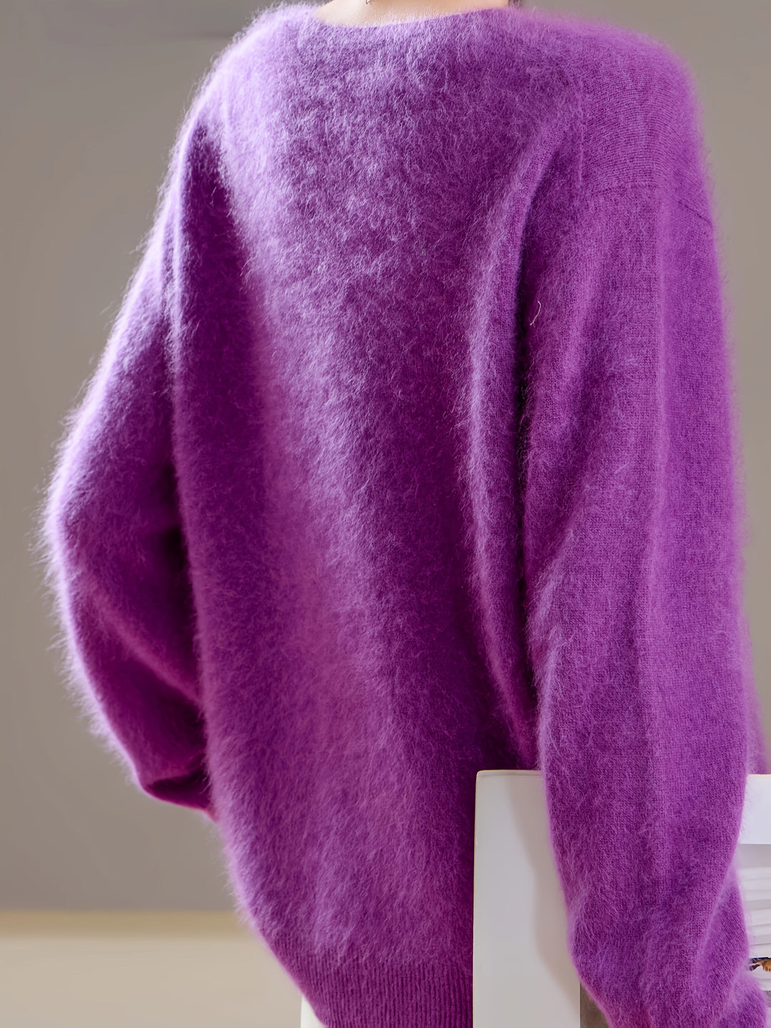Soft women's V-neck pullover sweater, perfect for stylish autumn layering.