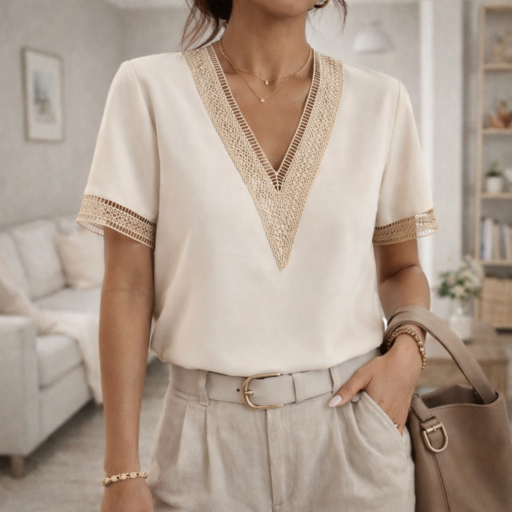 Women's V-neck top with elegant lace trim, a feminine blouse perfect for spring & summer fashion.