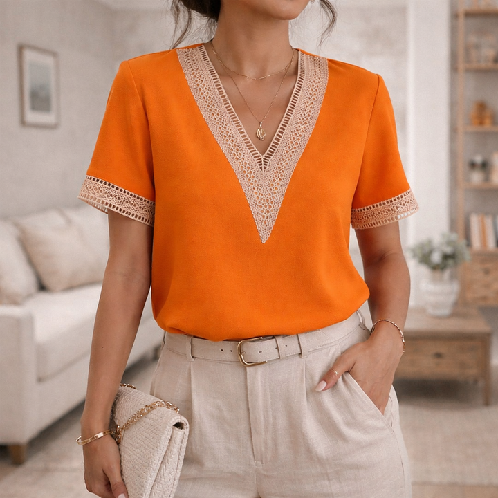 Elegant women's V-neck short sleeve top with delicate lace trim detail, a feminine & comfortable summer blouse.