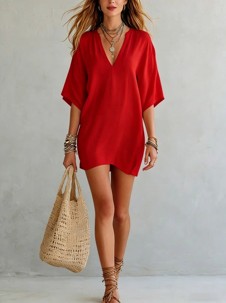 Stylish V-neck mini tunic dress for women, featuring a relaxed fit, great for summer, beach, or resort.